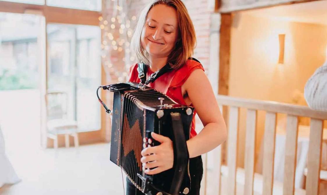 Woman playing the accordion.