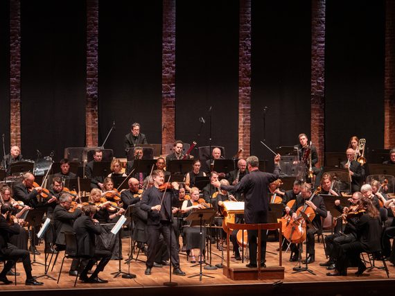 Orchestra playing onstage.