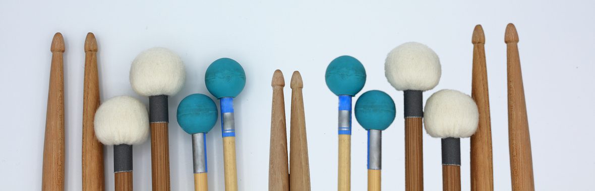 Percussion instruments against a white background.