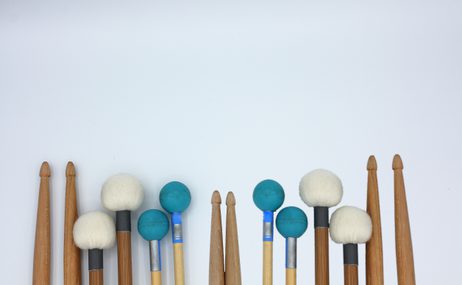 Percussion instruments against a white background.