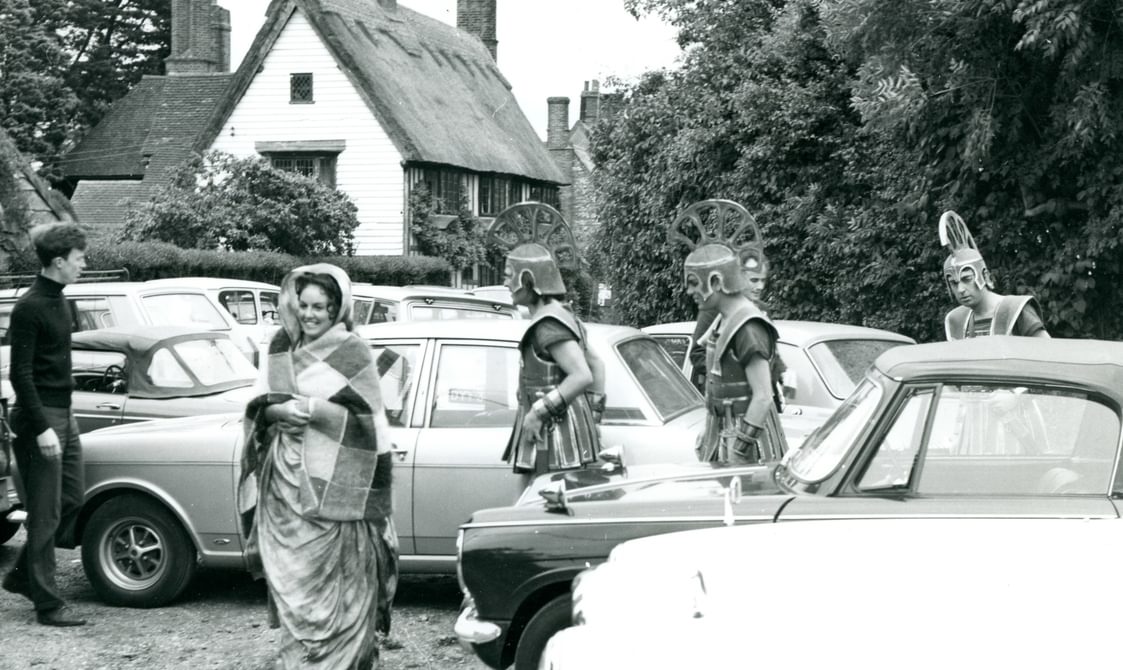 Photographs of performers, including Peter Pears, outside Blythburgh Church.