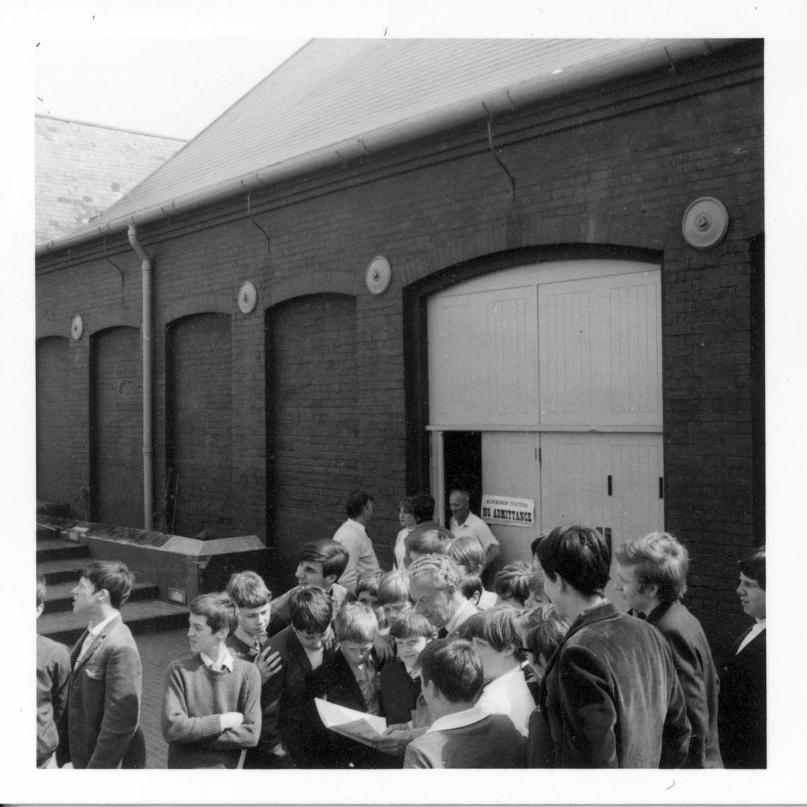 Britten with Wandsworth boys outside Snape Maltings Concert Hall, 1969