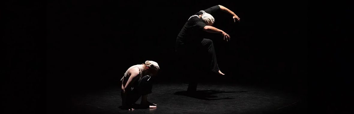 Dancers performing in silhouette