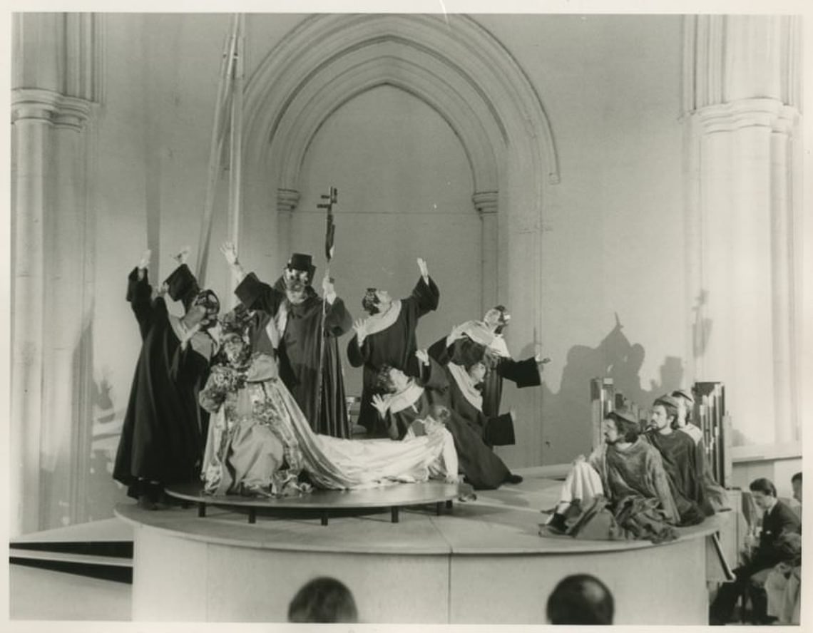 Performers on a stage in a church