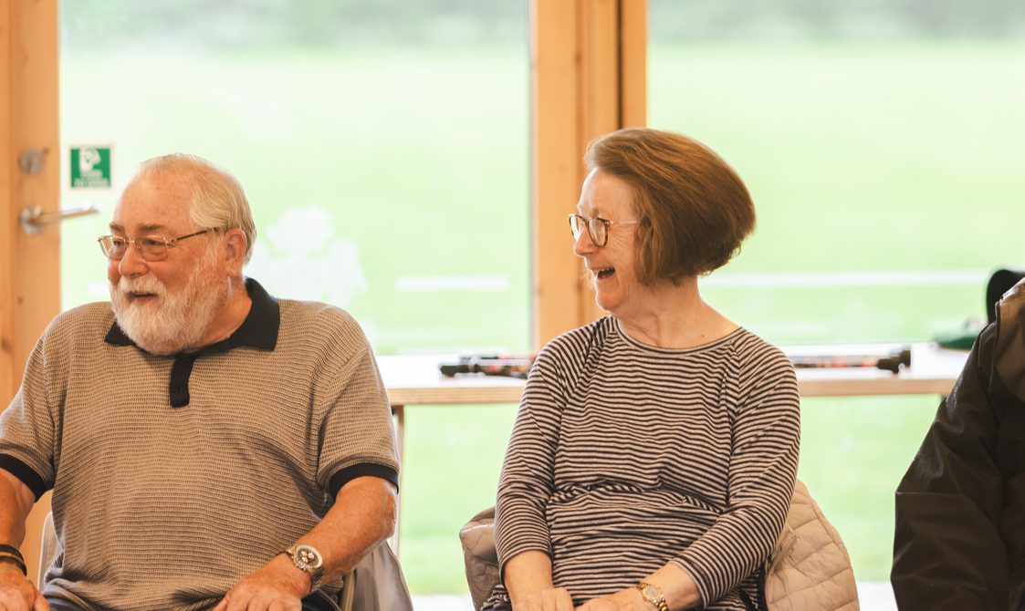 Man and woman sitting together and smiling