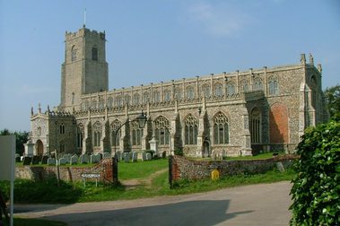 A large church with the graveyard in the foreground.
