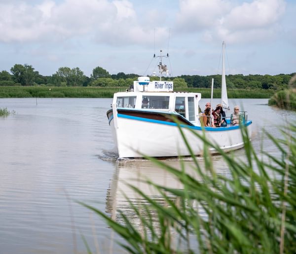 A boat on the river at Snape Maltings