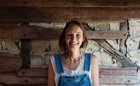 Portrait of Anna Greenland in dungarees