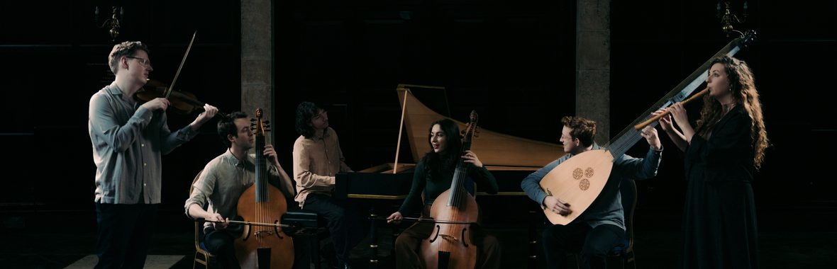 Bellot Ensemble, group of six musicians sitting and standing whilst playing baroque instruments against a dark background.