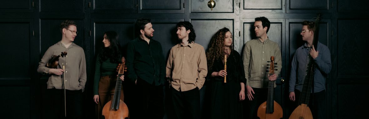 Bellot Ensemble, six musicians standing together with their instruments against a dark background.