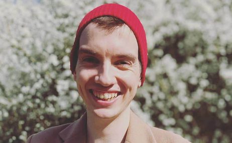 Robin Haigh portrait in red hat