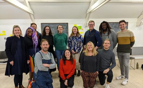 Two rows of people smiling at the camera