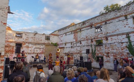 People in a derelict building at Snape Maltings