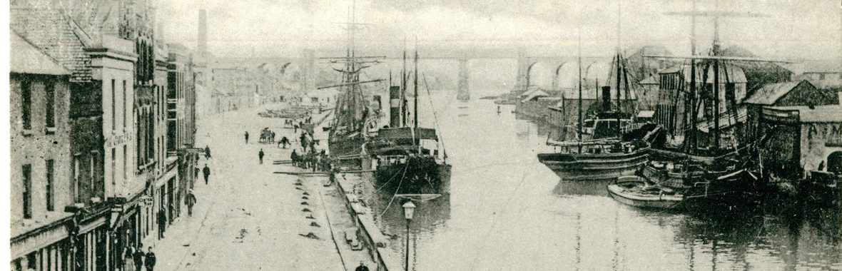 A black and white photograph of a river next to a road in 1953