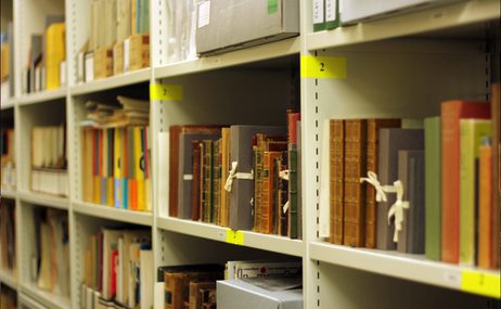 A series of books in a bookshelf.