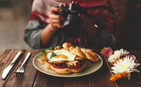 Person taking a photo of food.