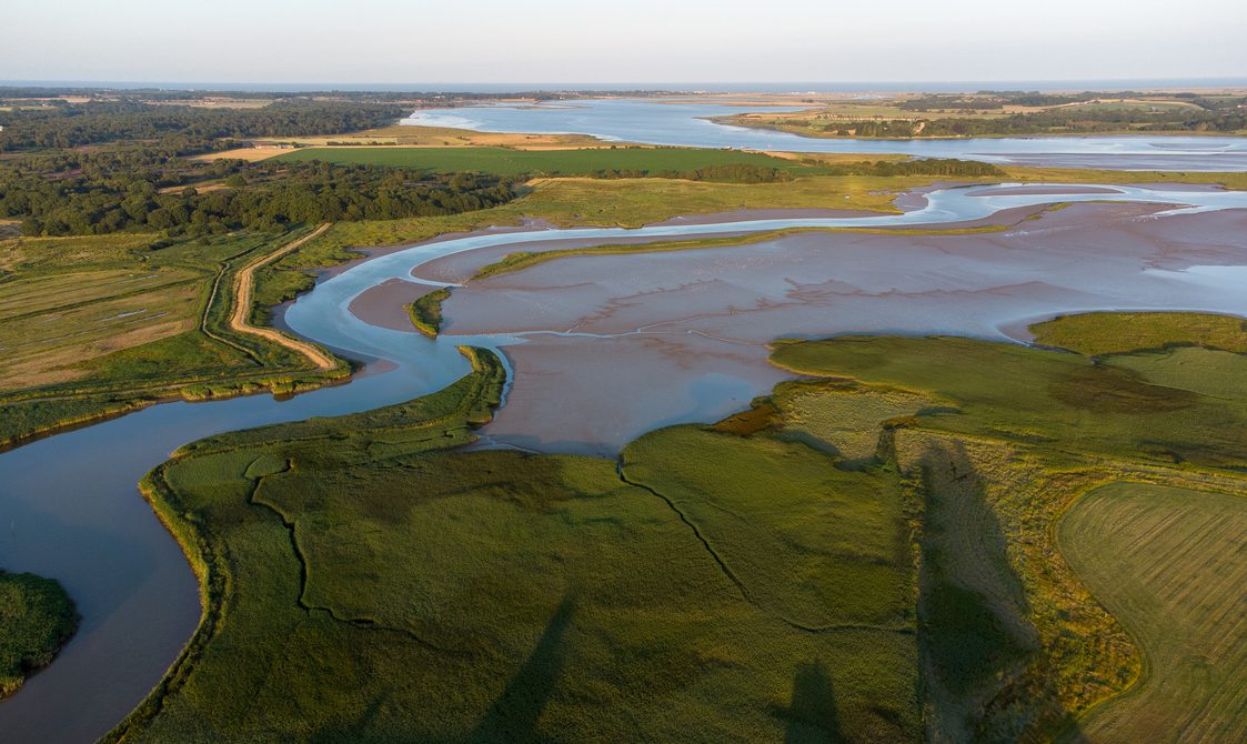 Aerial view of fields and the winding River Alde